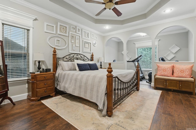 3051 Mount Mcgregor Dr, Benton, AR 72019 - bedroom featuring dark wood-type flooring, crown molding, a tray ceiling, and ceiling fan