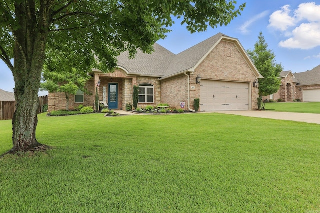 3051 Mount Mcgregor Dr, Benton, AR 72019 - view of front of home featuring an attached garage, concrete driveway, a front lawn, a shingled roof, and brick siding