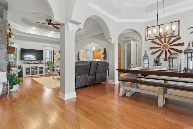 3051 Mount Mcgregor Dr, Benton, AR 72019 - entrance foyer featuring a raised ceiling, a ceiling fan, arched walkways, light wood-style floors, and ornamental molding
