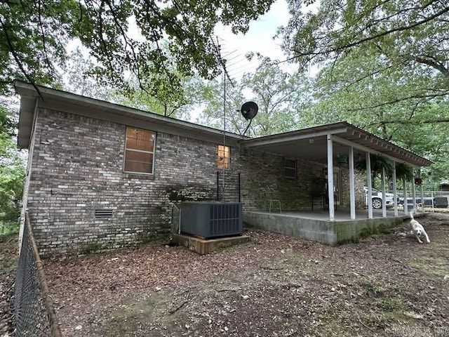 123 Quilters Ln, Hot Springs, AR 71909 - view of home's exterior with brick siding and a patio