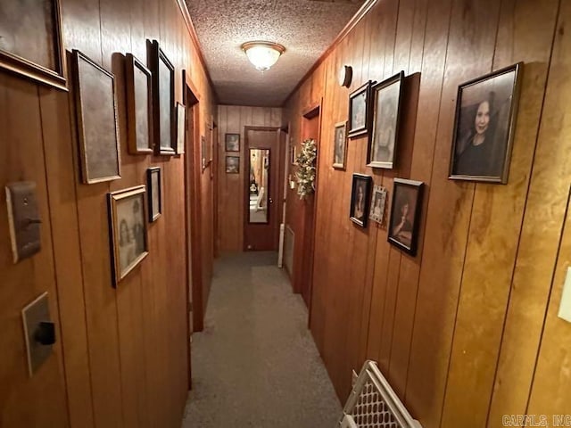 123 Quilters Ln, Hot Springs, AR 71909 - hall with light carpet, a textured ceiling, and wood walls