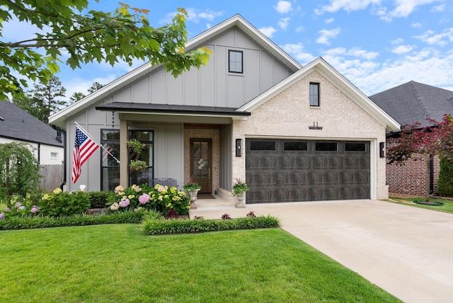 11 Saffron Cir, Little Rock, AR 72223 - view of front of house with board and batten siding, an attached garage, concrete driveway, a front yard, and brick siding