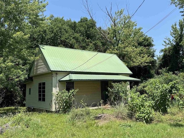104 Crumpler, Altus, AR 72821 - view of home's exterior featuring a metal roof