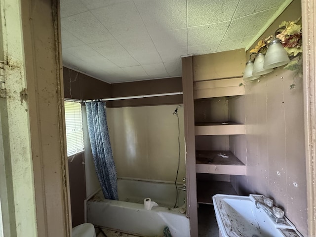 104 Crumpler, Altus, AR 72821 - bathroom featuring shower / bath combo with shower curtain and a sink