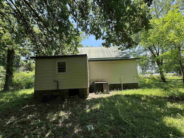 104 Crumpler, Altus, AR 72821 - view of property exterior featuring a central AC unit and a metal roof
