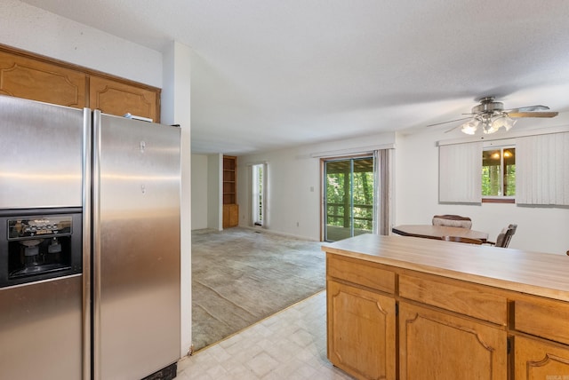 101 Winchester Ct, Fairfield Bay, AR 72088 - kitchen featuring stainless steel fridge with ice dispenser, light countertops, light floors, open floor plan, and a ceiling fan