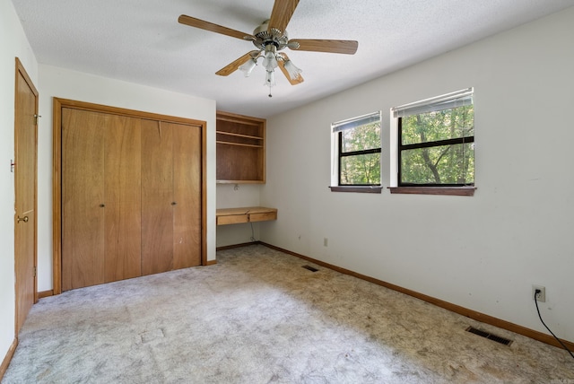 101 Winchester Ct, Fairfield Bay, AR 72088 - unfurnished bedroom featuring carpet floors, a closet, and ceiling fan