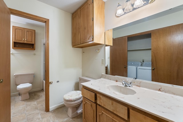 101 Winchester Ct, Fairfield Bay, AR 72088 - bathroom with vanity, washing machine and clothes dryer, and tile patterned floors