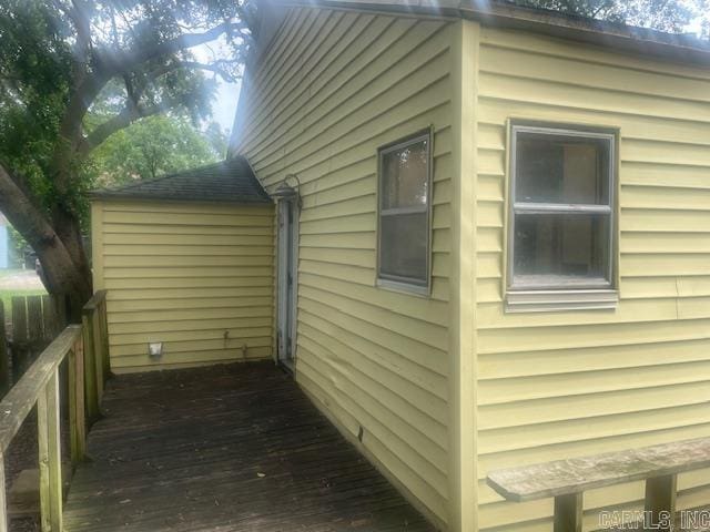 741 Macarthur Ave, Wake Village, TX 75501 - view of side of home featuring a deck