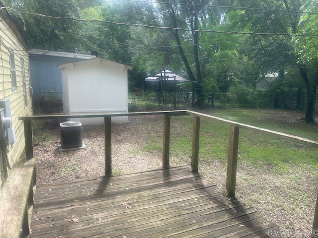 741 Macarthur Ave, Wake Village, TX 75501 - wooden deck with a yard