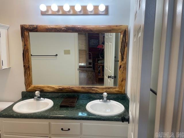 bathroom featuring double vanity