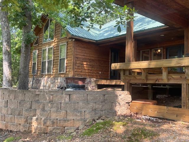 view of home's exterior featuring a metal roof
