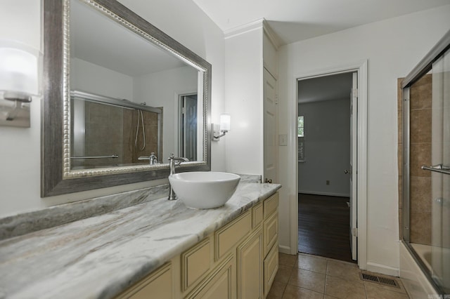 49 Kingsbridge Way, Little Rock, AR 72212 - bathroom featuring vanity, enclosed tub / shower combo, and tile patterned flooring