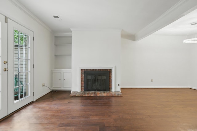 49 Kingsbridge Way, Little Rock, AR 72212 - unfurnished living room with ornamental molding, wood finished floors, a fireplace, built in shelves, and a chandelier