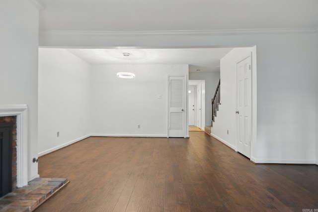 49 Kingsbridge Way, Little Rock, AR 72212 - unfurnished living room with dark wood-style floors, stairway, and crown molding