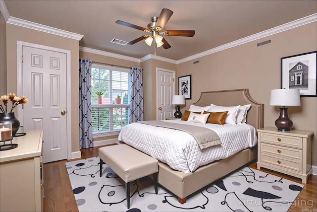 6708 Austin Harbor Loop, Sherwood, AR 72120 - bedroom with wood finished floors, ornamental molding, and a ceiling fan
