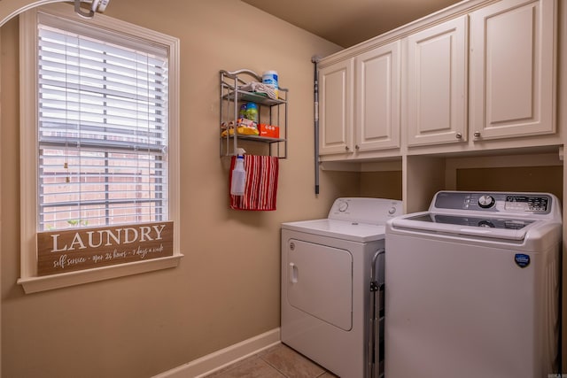 6708 Austin Harbor Loop, Sherwood, AR 72120 - laundry room with washing machine and clothes dryer, cabinet space, and light tile patterned floors