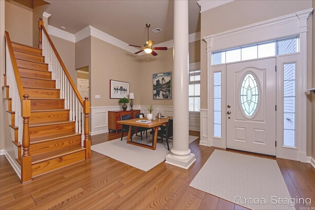 6708 Austin Harbor Loop, Sherwood, AR 72120 - entryway featuring decorative columns, ceiling fan, stairway, wood finished floors, and crown molding