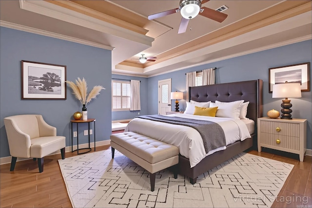 6708 Austin Harbor Loop, Sherwood, AR 72120 - bedroom with a raised ceiling, ornamental molding, wood finished floors, and a ceiling fan