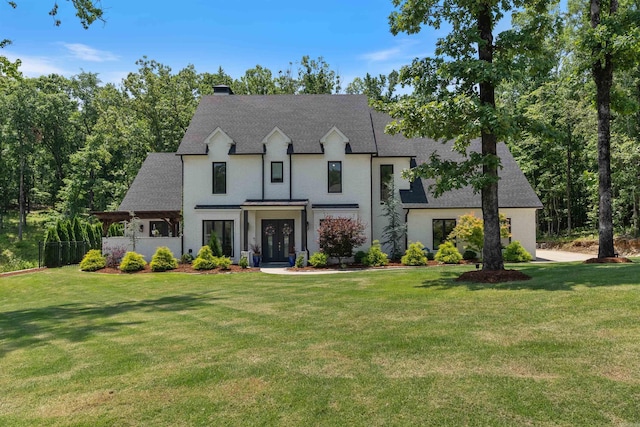 18001 Oak Creek Pl, Little Rock, AR 72223 - view of front facade with a chimney, a front yard, and a shingled roof