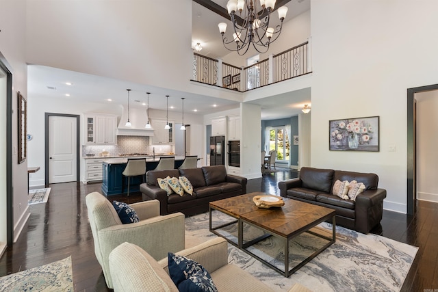 18001 Oak Creek Pl, Little Rock, AR 72223 - living room featuring dark wood-style flooring, a chandelier, and a high ceiling