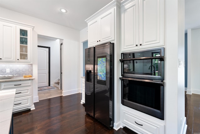 18001 Oak Creek Pl, Little Rock, AR 72223 - kitchen featuring stainless steel fridge, dark wood finished floors, white cabinets, and recessed lighting