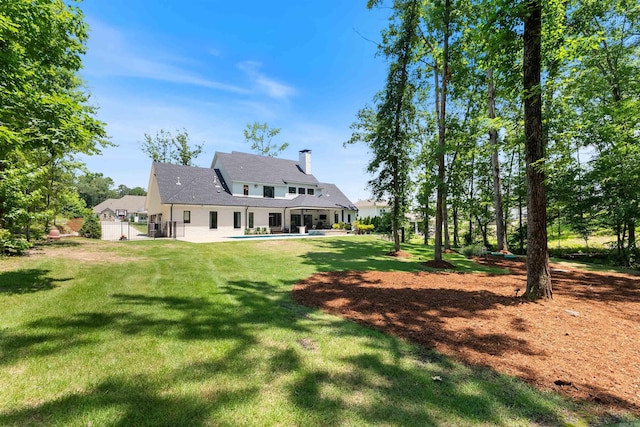 18001 Oak Creek Pl, Little Rock, AR 72223 - back of property featuring a chimney and a yard