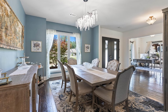 18001 Oak Creek Pl, Little Rock, AR 72223 - dining room with dark wood-type flooring, a chandelier, and french doors