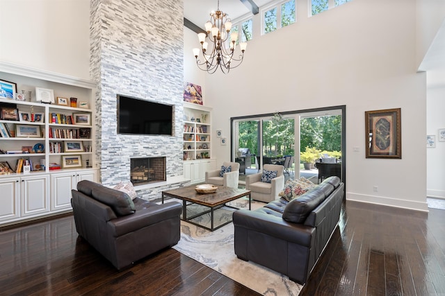 18001 Oak Creek Pl, Little Rock, AR 72223 - living area with a high ceiling, dark wood-style flooring, a chandelier, and healthy amount of natural light