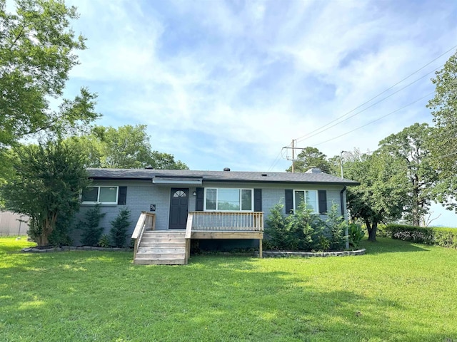 view of front facade featuring a front lawn and brick siding
