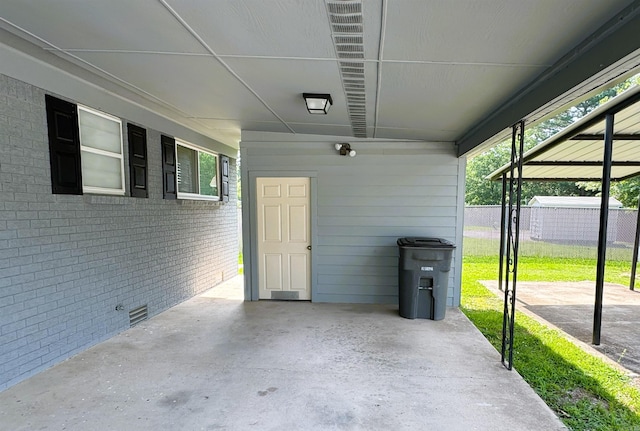 view of patio featuring an attached carport