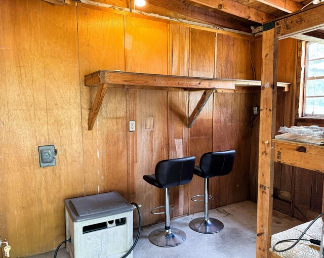 bar with wooden walls and concrete flooring