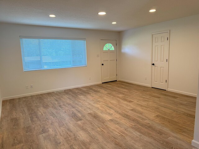 foyer entrance featuring recessed lighting and wood finished floors