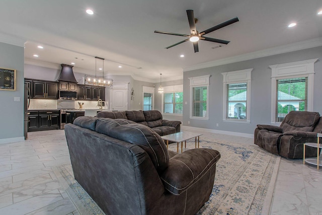 1027 Evening Sunset Cir, Redfield, AR 72132 - living area featuring light marble finish flooring, recessed lighting, ceiling fan, and crown molding