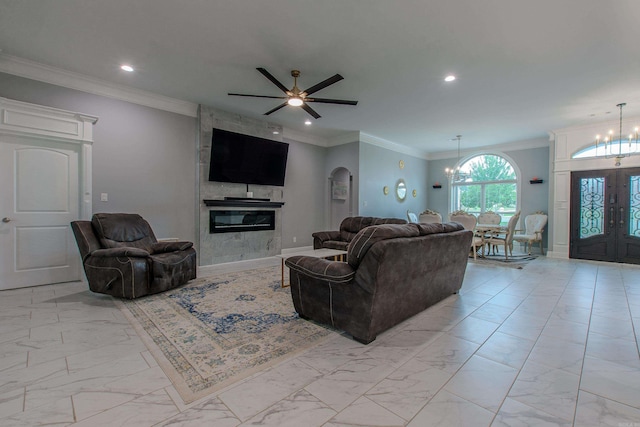 1027 Evening Sunset Cir, Redfield, AR 72132 - living area featuring light marble finish floors, a chandelier, recessed lighting, a fireplace, and ornamental molding