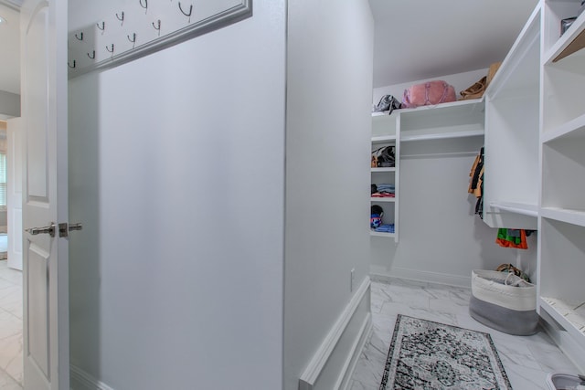 1027 Evening Sunset Cir, Redfield, AR 72132 - walk in closet featuring light marble finish floors