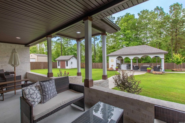 1027 Evening Sunset Cir, Redfield, AR 72132 - fenced backyard featuring outdoor lounge area, a patio area, and an outbuilding