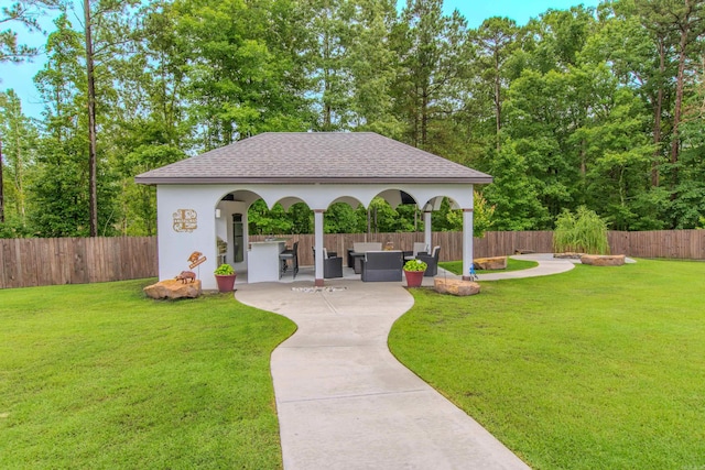 1027 Evening Sunset Cir, Redfield, AR 72132 - view of home's community featuring a patio, a fenced backyard, and an outdoor hangout area