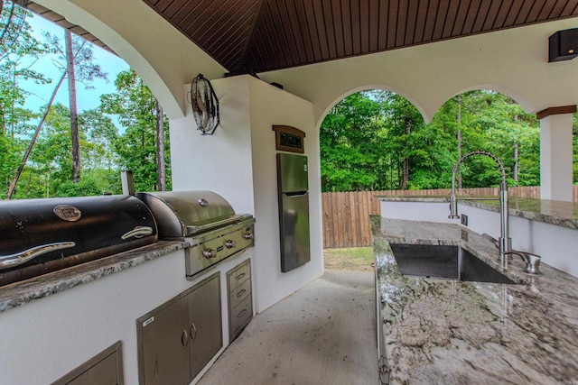 1027 Evening Sunset Cir, Redfield, AR 72132 - view of patio with a sink and exterior kitchen