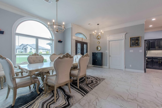 1027 Evening Sunset Cir, Redfield, AR 72132 - dining room featuring a chandelier, french doors, crown molding, light marble finish floors, and recessed lighting