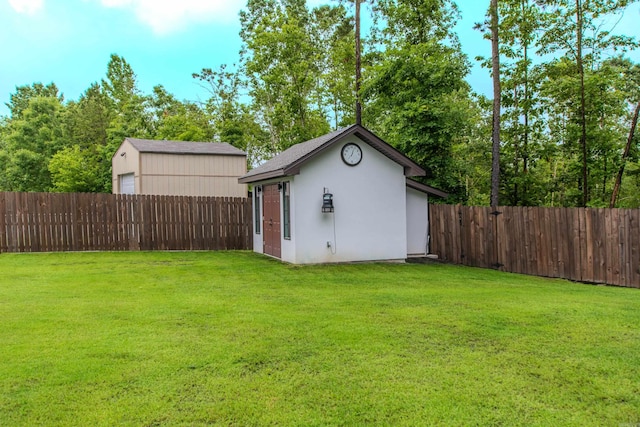 1027 Evening Sunset Cir, Redfield, AR 72132 - fenced backyard with an outdoor structure and a garage