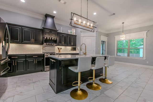 1027 Evening Sunset Cir, Redfield, AR 72132 - kitchen with stainless steel appliances, light marble finish flooring, an island with sink, a kitchen bar, and ornamental molding