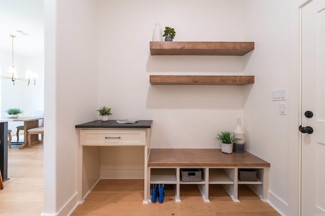 14408 Stonebrook Ln, Maumelle, AR 72113 - mudroom featuring light wood-style floors and a chandelier
