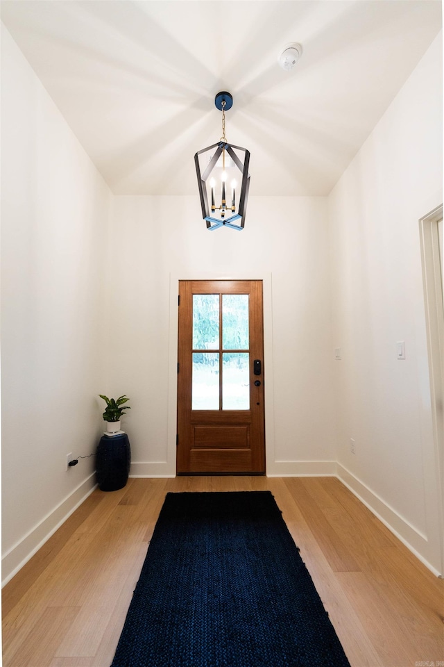 14408 Stonebrook Ln, Maumelle, AR 72113 - entryway with a chandelier and light wood-style flooring