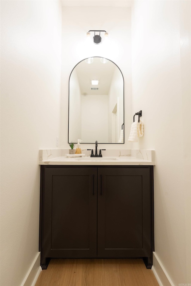 14408 Stonebrook Ln, Maumelle, AR 72113 - bathroom featuring vanity and wood finished floors