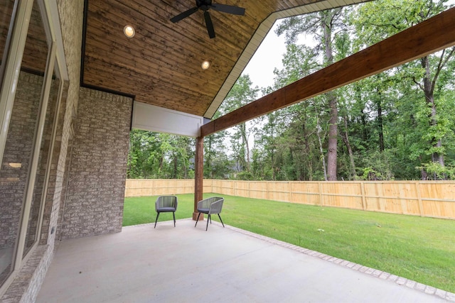 14408 Stonebrook Ln, Maumelle, AR 72113 - fenced backyard featuring a patio and a ceiling fan