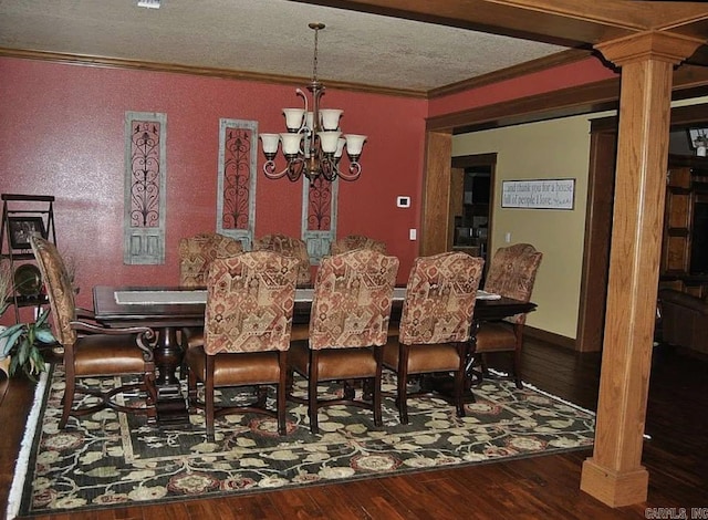 847 Woodland Hills Dr, Mountain View, AR 72560 - dining room featuring ornamental molding, decorative columns, a chandelier, hardwood / wood-style floors, and a textured ceiling