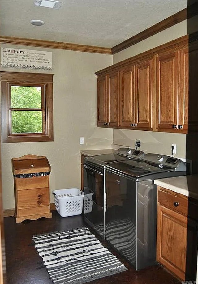 847 Woodland Hills Dr, Mountain View, AR 72560 - laundry area with cabinet space, washing machine and clothes dryer, and crown molding