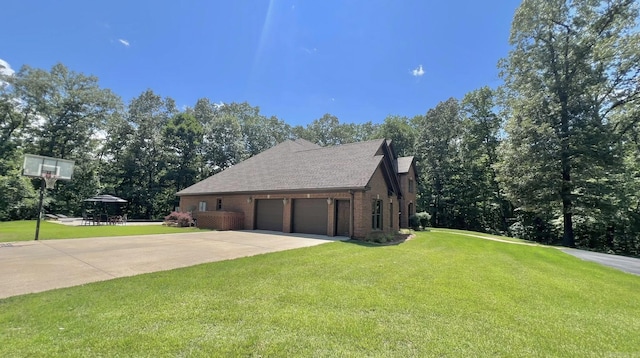 847 Woodland Hills Dr, Mountain View, AR 72560 - view of side of home with an attached garage, a lawn, concrete driveway, and brick siding