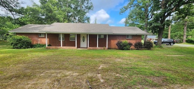 600 Robin Rd, White Hall, AR 71602 - ranch-style house featuring a porch, a front lawn, and brick siding